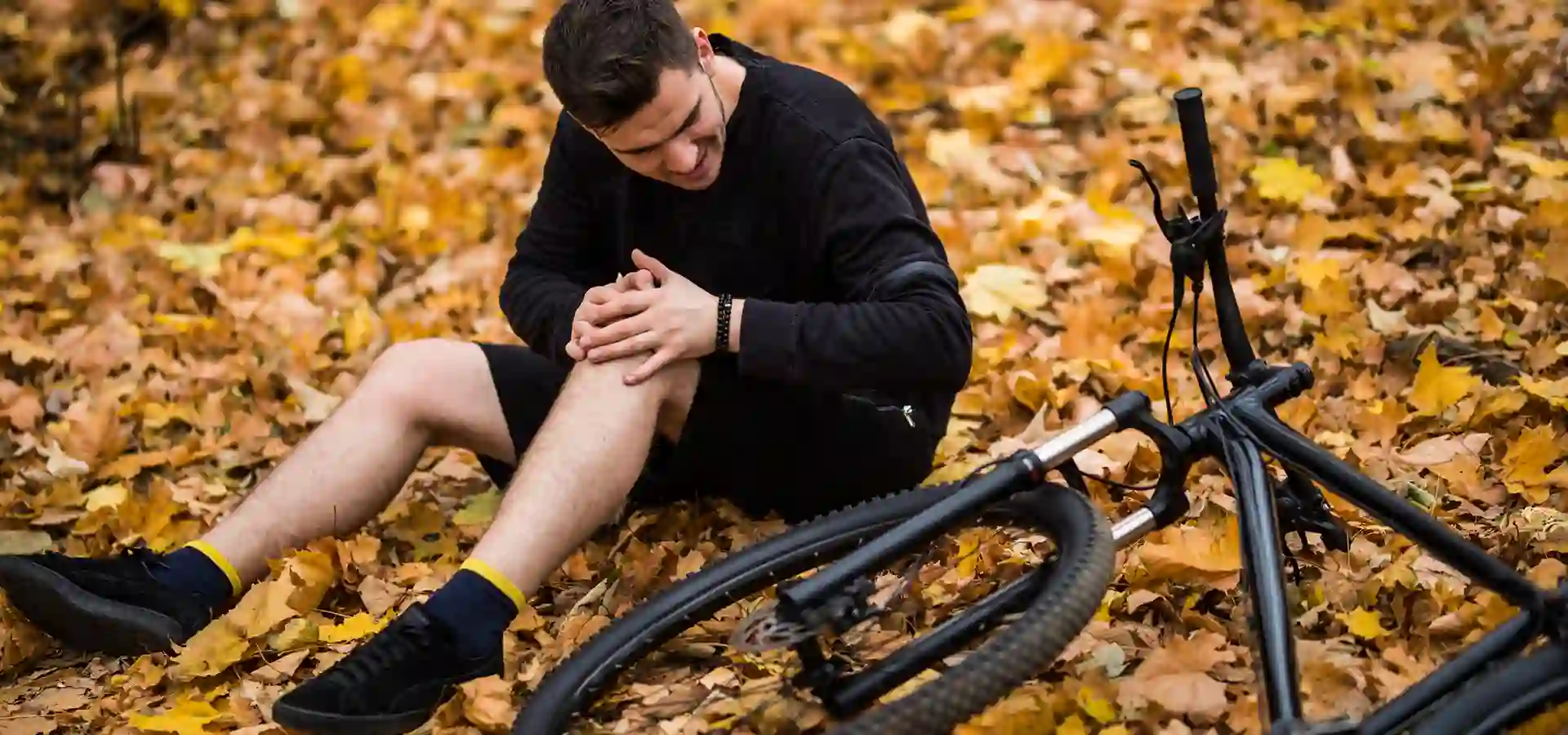 https://borenlaw.com/wp-content/uploads/2025/09/active-young-man-holding-by-his-hurt-broken-leg-while-lying-autumn-forest-path-by-his-bicycle-1.webp